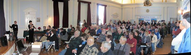 A crowd of people at a public meeting